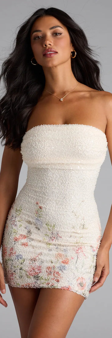 The Felicia Floral Beaded Mini Dress is your new go-to ivory dress—effortless, versatile, and made to update your fall style in seconds.