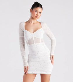 Step into winter chic with the Kendall Rhinestone Sheer Bodycon Mini Dress, a white mini dress featuring an above-the-knee cut ideal for cocktail parties, festive gatherings, or clubwear.