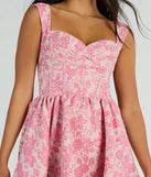 The Cassie Corset Floral Jacquard Party Skater Dress is an elegant pink formal dress in a rich seasonal color and with unique design accents that make dressing up for winter parties, holiday balls, or festive gatherings effortless!