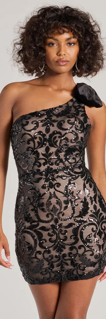 Turn heads in the beaming Allison One-Shoulder Velvet Bow Sequin Mini Dress, a stunning royal blue sequin dress designed to add sparkle and elegance to your next night out or special occasion.