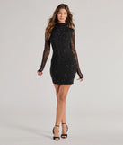 The Malia Rhinestone Sheer Mesh Formal Mini Dress is a stunning black mini dress with a short hem, designed to be the perfect winter cocktail dress or night-out look for the holiday season.