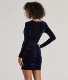 The Raina Velvet Long Sleeve Bodycon Mini Dress is a mini dress in navy, perfect for an above-the-knee holiday party dress or a stylish NYE look, with a short hemline designed to make a winter statement.