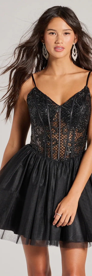Turn heads in the beaming Delani Sequin Corset Tulle A-Line Party Dress, a stunning black sequin dress designed to add sparkle and elegance to your next night out or special occasion.