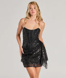 Turn heads in the beaming Candance Strapless Corset Sash Sequin Mini Dress, a stunning black sequin dress designed to add sparkle and elegance to your next night out or special occasion.