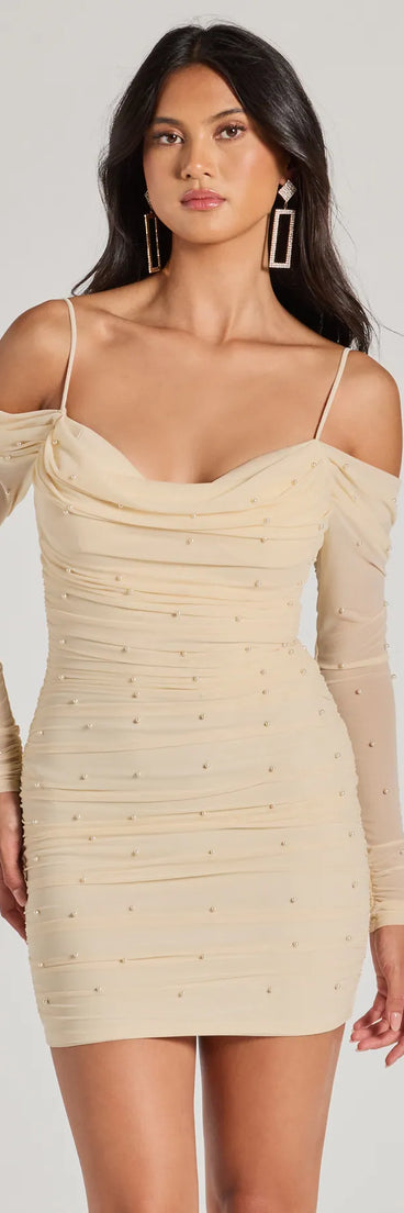 Step into seasonal chic with the Talia Pearl Mesh Cold-Shoulder Mini Dress, a ivory mini dress featuring an above-the-knee cut ideal for cocktail parties, festive gatherings, or clubwear.
