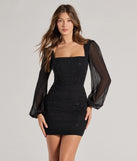 Step into winter chic with the Meilani Rhinestone Mesh Long Sleeve Mini Dress, a black mini dress featuring an above-the-knee cut ideal for cocktail parties, festive gatherings, or clubwear.