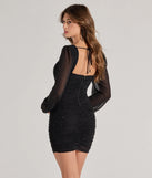 Turn heads with the Meilani Rhinestone Mesh Long Sleeve Mini Dress, a black New Year's Eve dress featuring a festive style and glamorous accents, ideal for any NYE celebration or cocktail party.