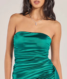The Carlene Ruched Satin Bodycon Mini Dress is a teal dress, an essential holiday or NYE dress that pairs chic style with versatility making it perfect for cocktail events, New Year's Eve parties, or as a winter wedding guest look.