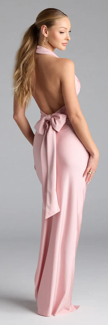 Own the spotlight in the Darla Halter Open Back Bow Slit Formal Dress, a pink formal dress crafted to deliver luxe style for autumn weddings, Military Balls, or any special event.
