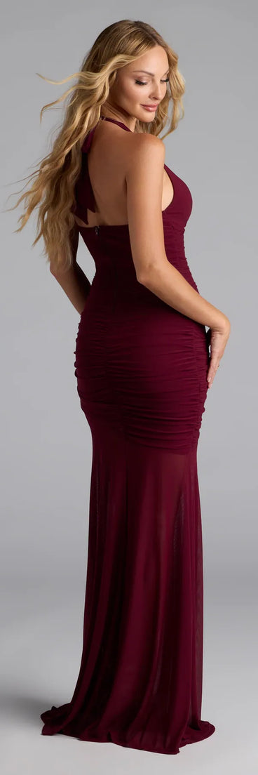 Own the spotlight in the Mia Halter Slit Mermaid Mesh Formal Dress, a burgundy formal dress crafted to deliver luxe style for autumn weddings, Military Balls, or any special event.