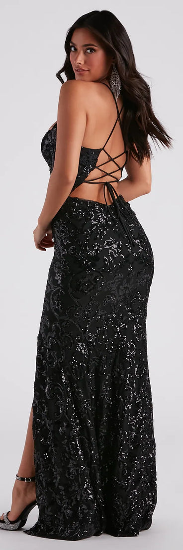 The Lori Formal Sequin Lace-Up Long Dress is a show-stopping black homecoming dress, offering a sleek, slimming silhouette that enhances your natural beauty for an unforgettable night.