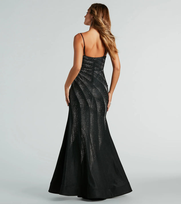 The stunning Tessa Formal Rhinestone Mermaid Slit Long Dress provides a chic silhouette and party-ready details that make it a standout black dress for cocktail events, New Year's Eve parties, or as a winter wedding guest look.