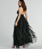 The Wynonna V-Neck A-Line Ruffle Glitter Formal Dress is an elegant black formal dress in a rich seasonal color and with unique design accents that make dressing up for winter parties, holiday balls, or festive gatherings effortless!