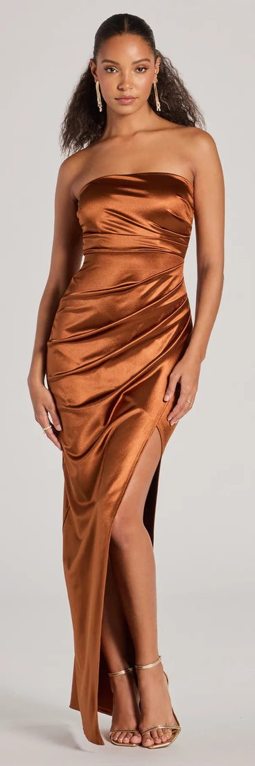 Turn heads at Prom 2025 in this mocha prom dress, where statement-making details meet the iconic style of the Lauren Strapless Wrap Slim Satin Formal Dress .