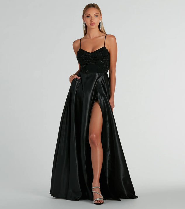 The Ammara Cowl Neck Slit A-Line Satin Formal Dress is an elegant black formal dress in a rich seasonal color and with unique design accents that make dressing up for winter parties, holiday balls, or festive gatherings effortless!