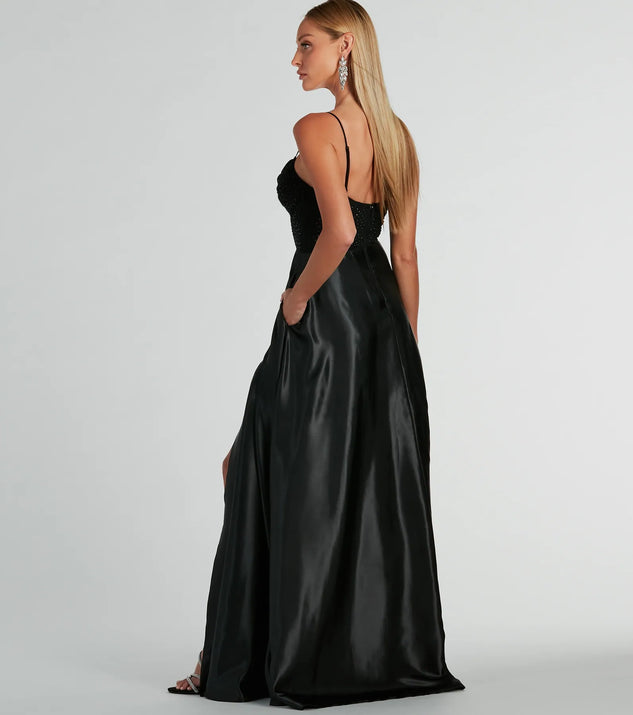 The Ammara Cowl Neck Slit A-Line Satin Formal Dress is an elegant black formal dress in a rich seasonal color and with unique design accents that make dressing up for winter parties, holiday balls, or festive gatherings effortless!
