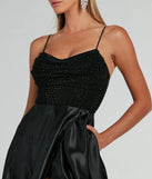 The Ammara Cowl Neck Slit A-Line Satin Formal Dress is an elegant black formal dress in a rich seasonal color and with unique design accents that make dressing up for winter parties, holiday balls, or festive gatherings effortless!