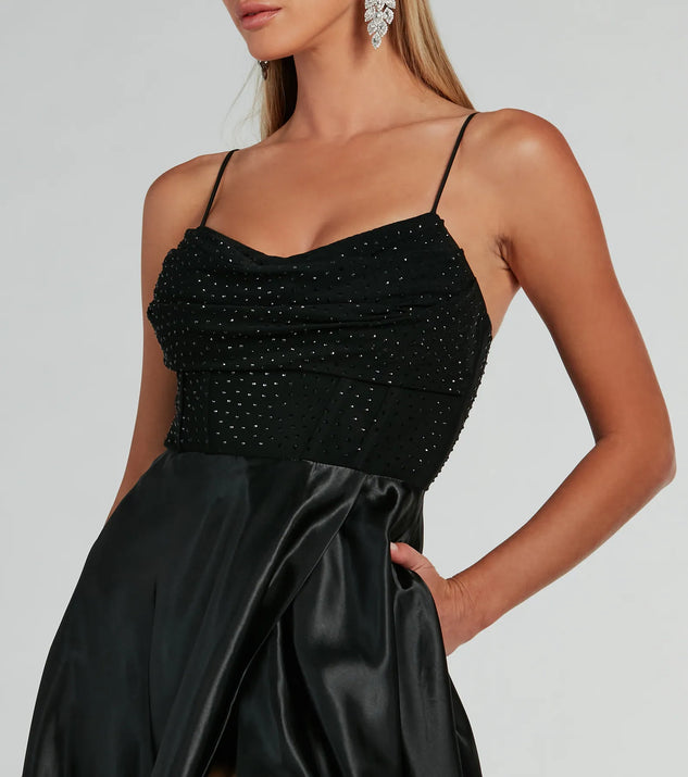 The Ammara Cowl Neck Slit A-Line Satin Formal Dress is an elegant black formal dress in a rich seasonal color and with unique design accents that make dressing up for winter parties, holiday balls, or festive gatherings effortless!