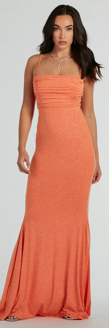 Turn heads at HOCO 2025 in this orange homecoming dress, where statement-making details meet the iconic style of the Colleen Lace Up Mermaid Glitter Formal Dress.