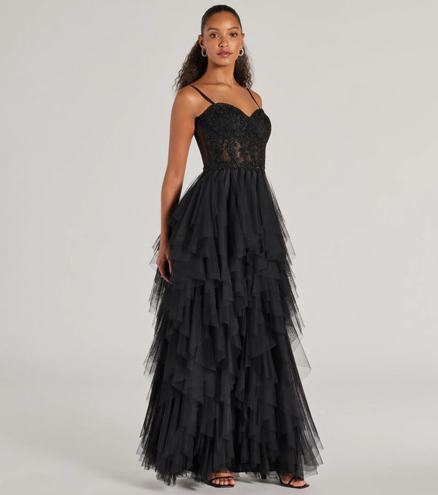 The Keyla Floral Applique Tiered Ruffle Tulle Gown is an elegant black formal dress in a rich seasonal color and with unique design accents that make dressing up for winter parties, holiday balls, or festive gatherings effortless!