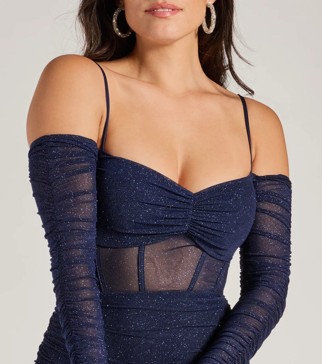 The Jaenessa Cold Shoulder Glitter Mermaid Formal Dress is an elegant navy blue formal dress in a rich seasonal color and with unique design accents that make dressing up for winter parties, holiday balls, or festive gatherings effortless!