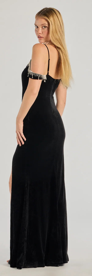 The Torrie Velvet Rhinestone High-Slit Mermaid Dress is a show-stopping black prom dress, offering a sleek, slimming silhouette that enhances your natural beauty for an unforgettable night.