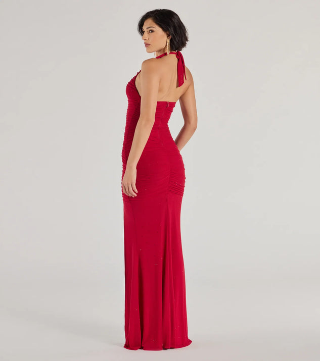 The Kindra High-Slit Mermaid Halter Dress is an elegant red formal dress in a rich seasonal color and with unique design accents that make dressing up for winter parties, holiday balls, or festive gatherings effortless!