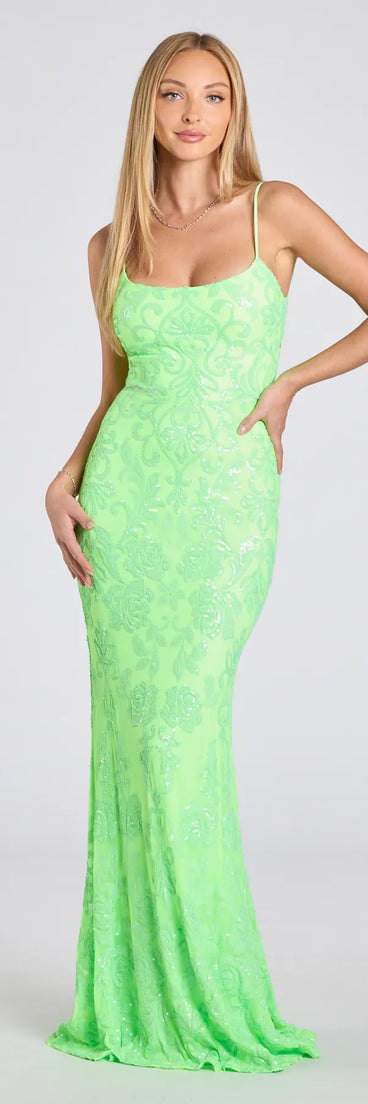 Own the spotlight in the Khloe Strappy Back Mermaid Sequin Formal Dress, a lime green formal dress crafted to deliver luxe style for autumn weddings, Military Balls, or any special event.