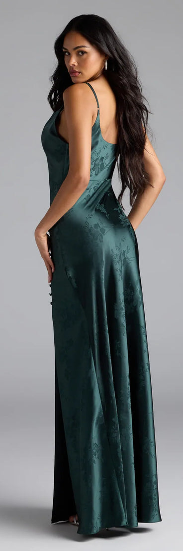 Own the spotlight in the Gigi Cowl Neck Button Slit Satin Formal Dress, a hunter green formal dress crafted to deliver luxe style for autumn weddings, Military Balls, or any special event.