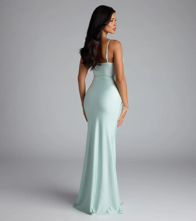 Own the spotlight in the Marcie Cowl Neck Slit Mermaid Formal Dress, a mint green formal dress crafted to deliver luxe style for autumn weddings, Military Balls, or any special event.