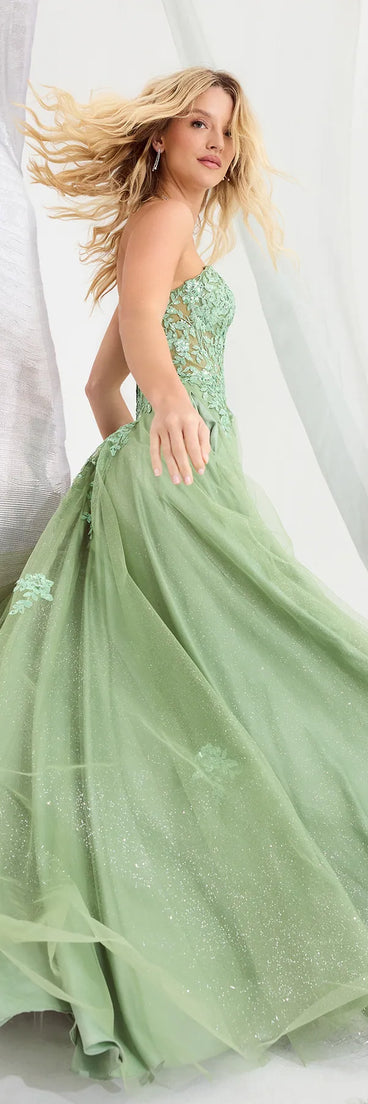 The Petra Sequin Floral Applique Glitter Tulle Gown is a stylish sage floral dress featuring a fresh seasonal print and flattering design, perfect for garden parties, bridal showers, Valentine's Day celebrations, or everyday spring styling.
