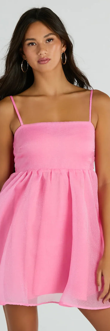 The Babe Of The Hour Sleeveless Bow Back Babydoll Dress is a mini dress that will make a statement with its short hemline and on-trend details to have you ready for any event!