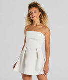 Step into winter chic with the Sweet And Sassy Strapless Scuba Knit Skater Dress, a white mini dress featuring an above-the-knee cut ideal for cocktail parties, festive gatherings, or clubwear.
