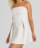 The Sweet And Sassy Strapless Scuba Knit Skater Dress is a stunning white mini dress with a short hem, designed to be the perfect winter cocktail dress or night-out look for the holiday season.