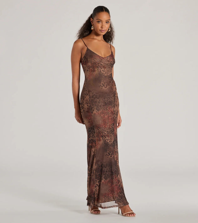 The Fierce Allure Leopard Print Mesh Maxi Dress is a leopard print dress, an essential holiday or NYE dress that pairs chic style with versatility making it perfect for cocktail events, New Year's Eve parties, or as a winter wedding guest look.