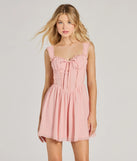 Step into winter chic with the Such A Flirt Sweetheart Lace Trim Skater Dress, a pink mini dress featuring an above-the-knee cut ideal for cocktail parties, festive gatherings, or clubwear.