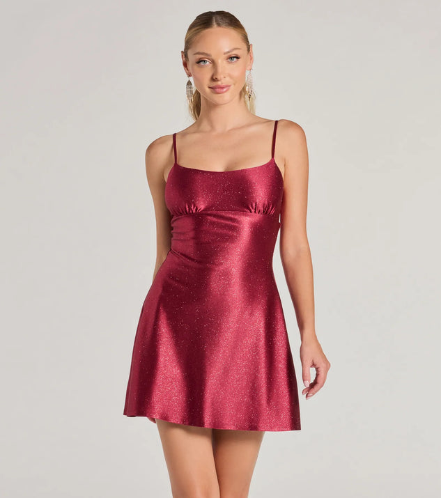 Step into winter chic with the Glistening Beauty Glitter Satin Mini Dress, a raisin purple mini dress featuring an above-the-knee cut ideal for cocktail parties, festive gatherings, or clubwear.