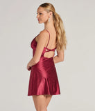 Turn heads with the Glistening Beauty Glitter Satin Mini Dress, a burgundy New Year's Eve dress featuring a festive style and glamorous accents, ideal for any NYE celebration or cocktail party.