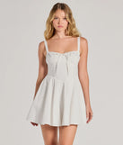 Step into winter chic with the Ray Of Beauty Lace-Up Corset Skater Dress, a white mini dress featuring an above-the-knee cut ideal for cocktail parties, festive gatherings, or clubwear.
