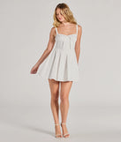 The Ray Of Beauty Lace-Up Corset Skater Dress is a stunning white mini dress with a short hem, designed to be the perfect winter cocktail dress or night-out look for the holiday season.