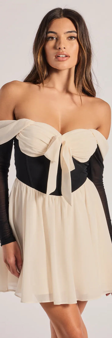 Perfectly Chic Bow Detail Off-The-Shoulder Skater Dress, a trendy ivory mini dress featuring modern details and a fresh seasonal hue, perfect for creating chic 2025 looks.