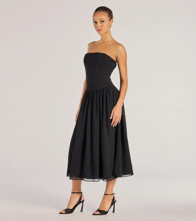 Elevate your winter wardrobe with the Stylish Moment Drop Waist A-Line Midi Dress— a party-ready black cocktail dress featuring seasonal accents and a sophisticated style, ideal for semi-formal holiday events from family dinners to NYE celebrations.