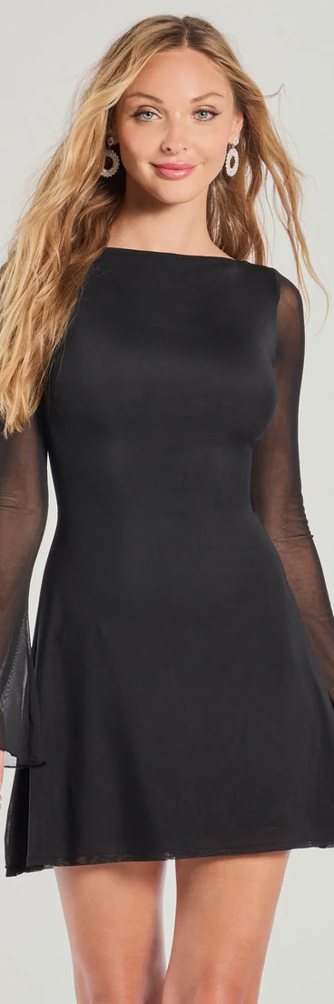 Feel instantly put-together in the Sheer Style Low Back Fit And Flare Mini Dress in black, a summer wedding guest dress designed for confident style and all-out celebration.