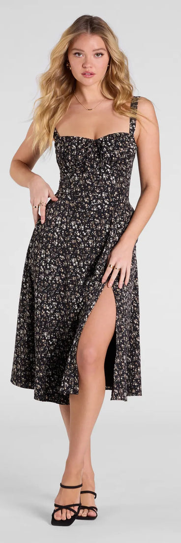 The Thriving Blooms Corset Floral Slit Midi Dress in black features a flattering fit and mid-calf hem, redefining effortless midi dresses for any occasion.