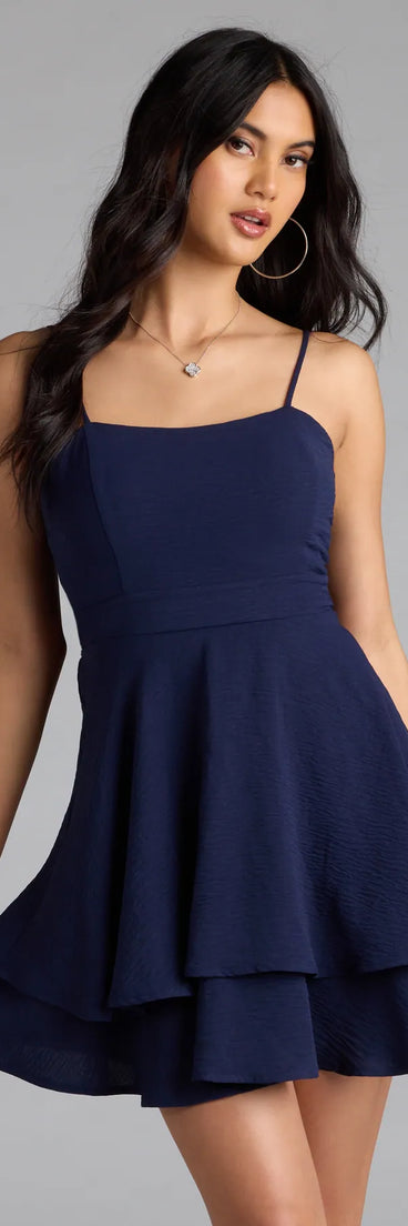 Shine with confidence, elegance, and standout style in the Lovely Day Tie Back Ruffle Skater Dress—a navy blue homecoming dress designed with a fresh silhouette and the latest trends.