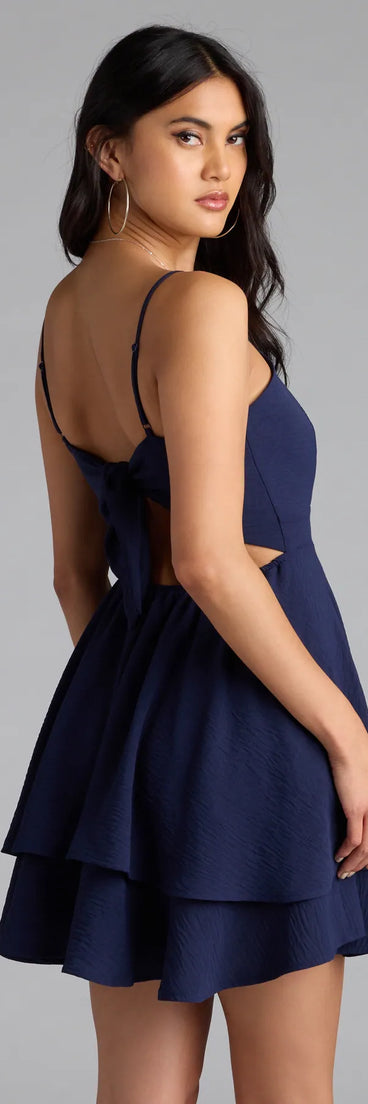 Own your moment in the Lovely Day Tie Back Ruffle Skater Dressin navy blue, a standout 2025 Homecoming Dress that captures all the glam and energy of the night.