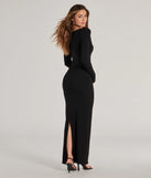 The stunning Layered In Glam Ribbed Knit Long Sleeve Maxi Dress provides a chic silhouette and party-ready details that make it a standout black dress for cocktail events, New Year's Eve parties, or as a winter wedding guest look.
