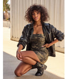 The Attention-Worthy Camo Print Bodycon Mini Dress is a olive dress, an essential holiday or NYE dress that pairs chic style with versatility making it perfect for cocktail events, New Year's Eve parties, or as a winter wedding guest look.