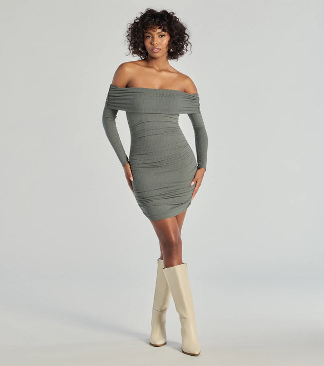 The Flawless Style Knit Off-The-Shoulder Long Sleeve Mini Dress is a olive dress, an essential holiday or NYE dress that pairs chic style with versatility making it perfect for cocktail events, New Year's Eve parties, or as a winter wedding guest look.
