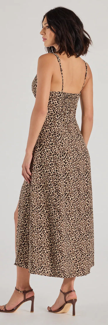 Revamp your 2025 wardrobe with this chic addition, the Elevated Leopard Print Woven A-Line Midi Dress in brown, perfect for elevating your style in the new year.